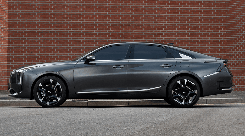 Grey Kia K4 saloon, side view, after
